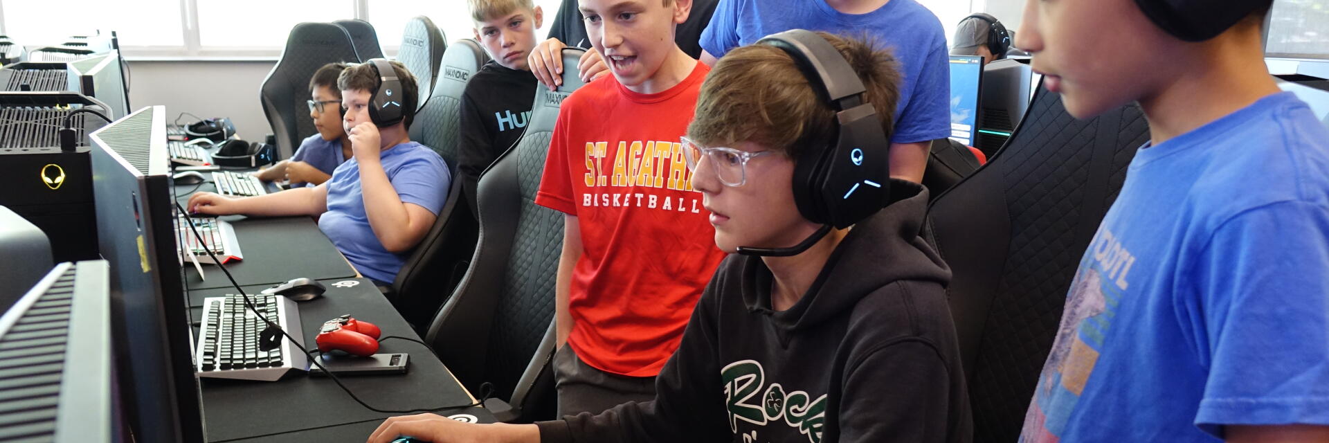 Kids playing computer game at summer camp